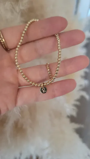 Beaded Stretch Bracelet With Initial Charm.