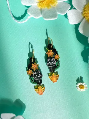 Black Cat with Daffodil Flower