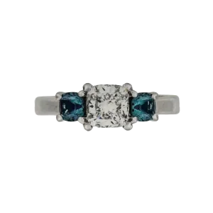 PLATINUM 1.08CT F VS1 CUSHION SET IN A PAST, PRESENT AND FUTURE MOUNTING WITH TWO ROUND LABORATORY GROWN ALEXANDRITES CERTIFIED BY GIA #5234160482 FOR CUSHION  AND GIA #2231160642 FOR ROUND ALEXANDRITES