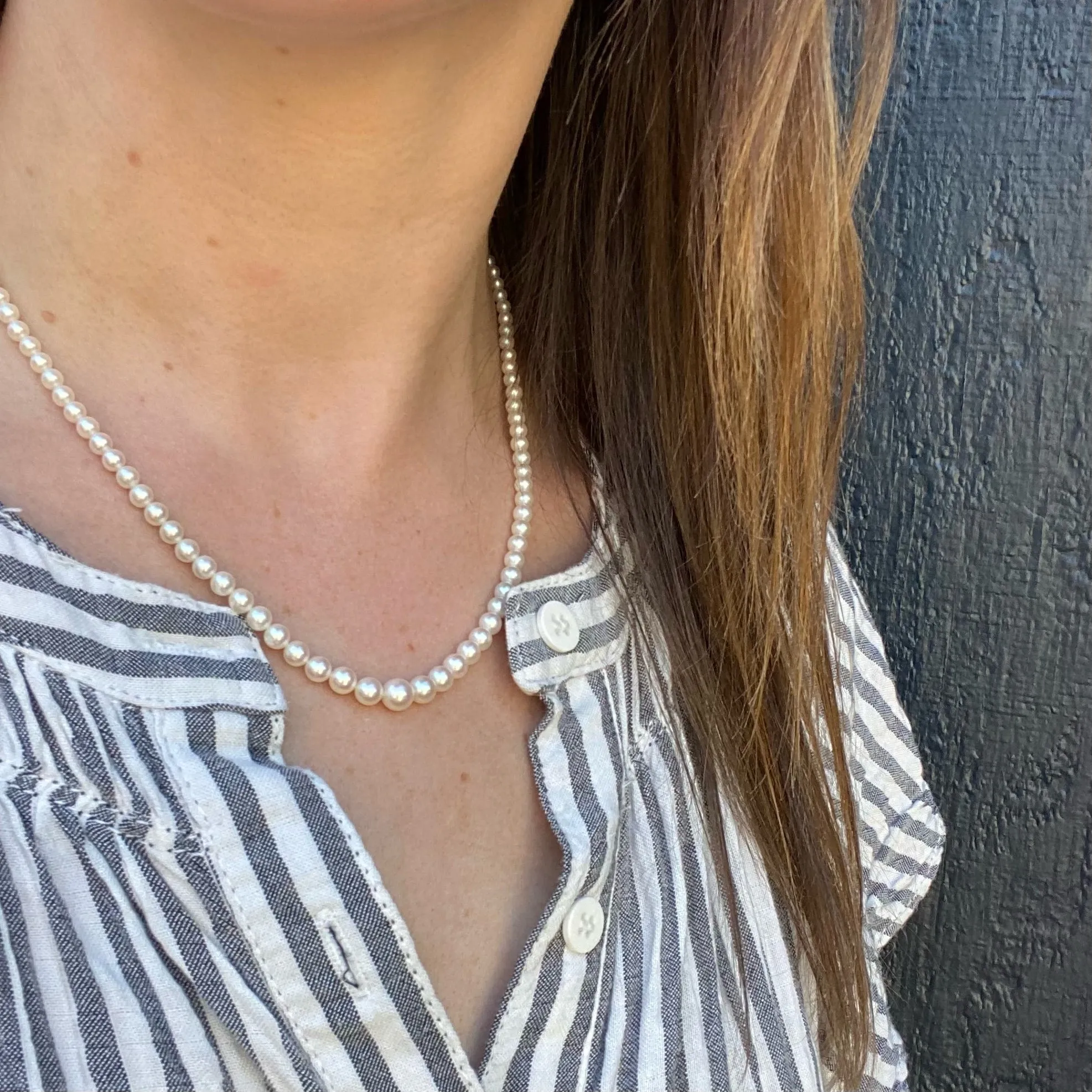Radiant Strand of Pearls with Gold Clasp
