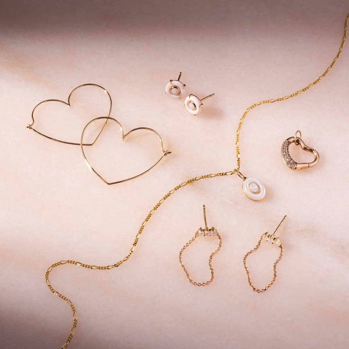 Solid Gold Slim Heart Hoops
